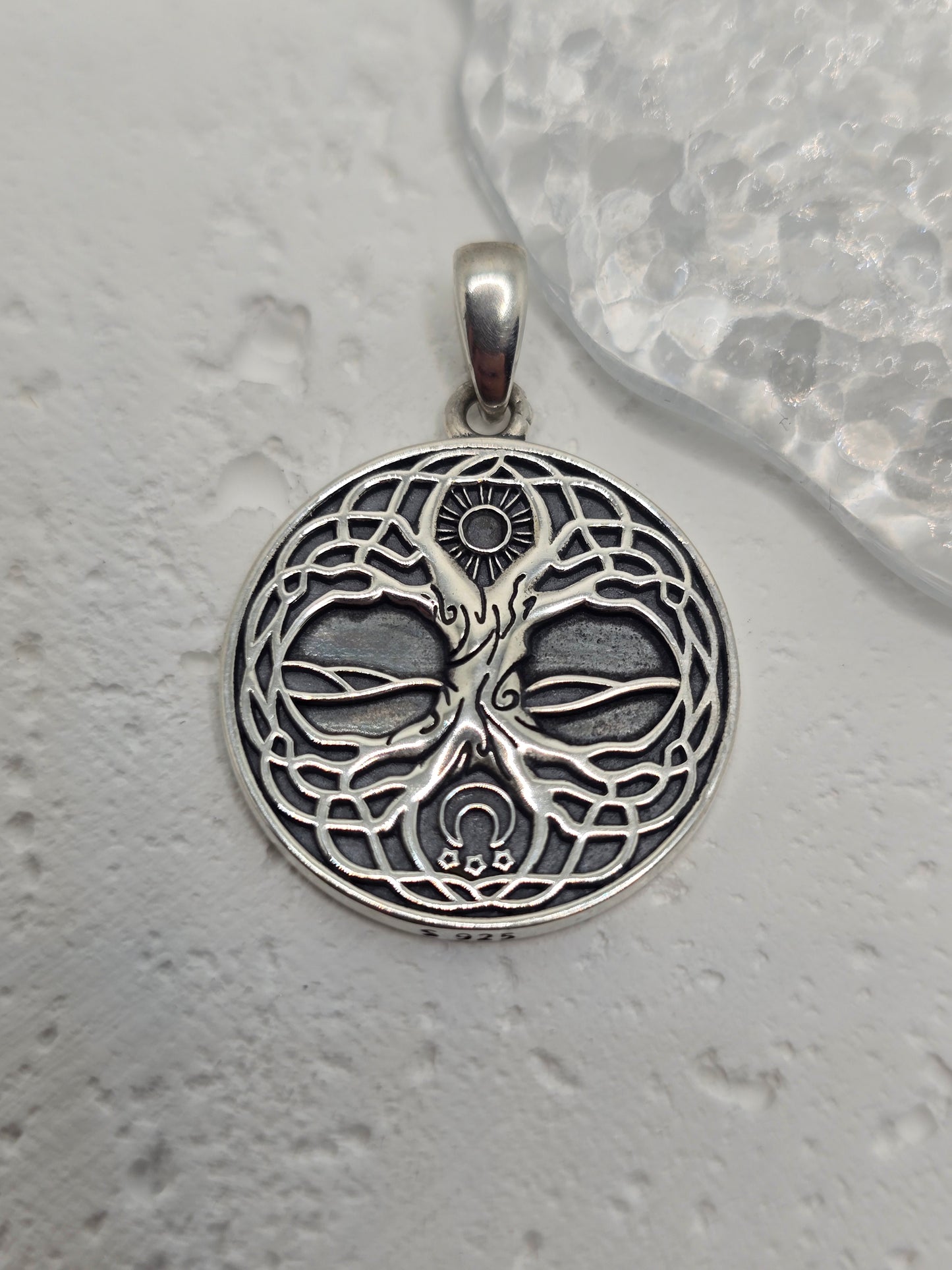 Honor ancient wisdom and connection with the Viking Yggdrasil Tree of Life Amulet, crafted in solid 925 sterling silver. Intricate branches and roots depict Yggdrasil, the sacred tree linking heaven, earth, and underworld—symbolising growth, strength, protection, and the bond between all realms. Fine engraving and a textured reverse add depth and artisan character for a meaningful, heirloom-worthy piece.
Key Features:
Made from high-quality 925 Sterling Silver
Detailed Yggdrasil (Tree of Life) motif for N