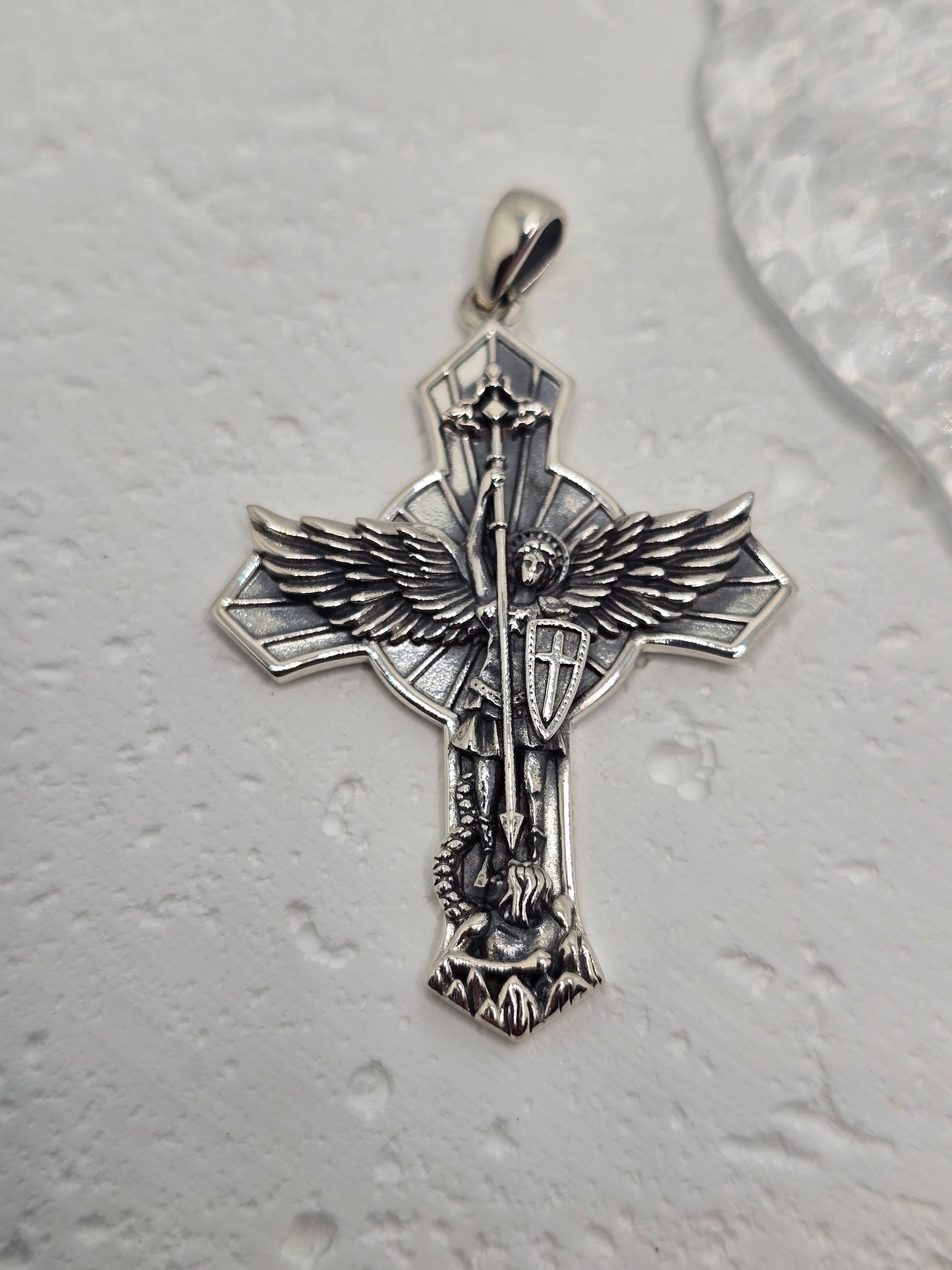 Embrace courage, justice, and divine guardianship with the Saint Michael Archangel Winged Cross Pendant, crafted in solid 925 sterling silver. Depicted in armour with sword drawn and wings outstretched, Saint Michael stands as a timeless symbol of protection and strength.
Intricate detailing across the cross, armour, and feathered wings gives this devotional piece a refined presence. Wear it as a daily talisman or gift it to mark confirmations, spiritual milestones, or moments of personal resolve.
Key Fea
