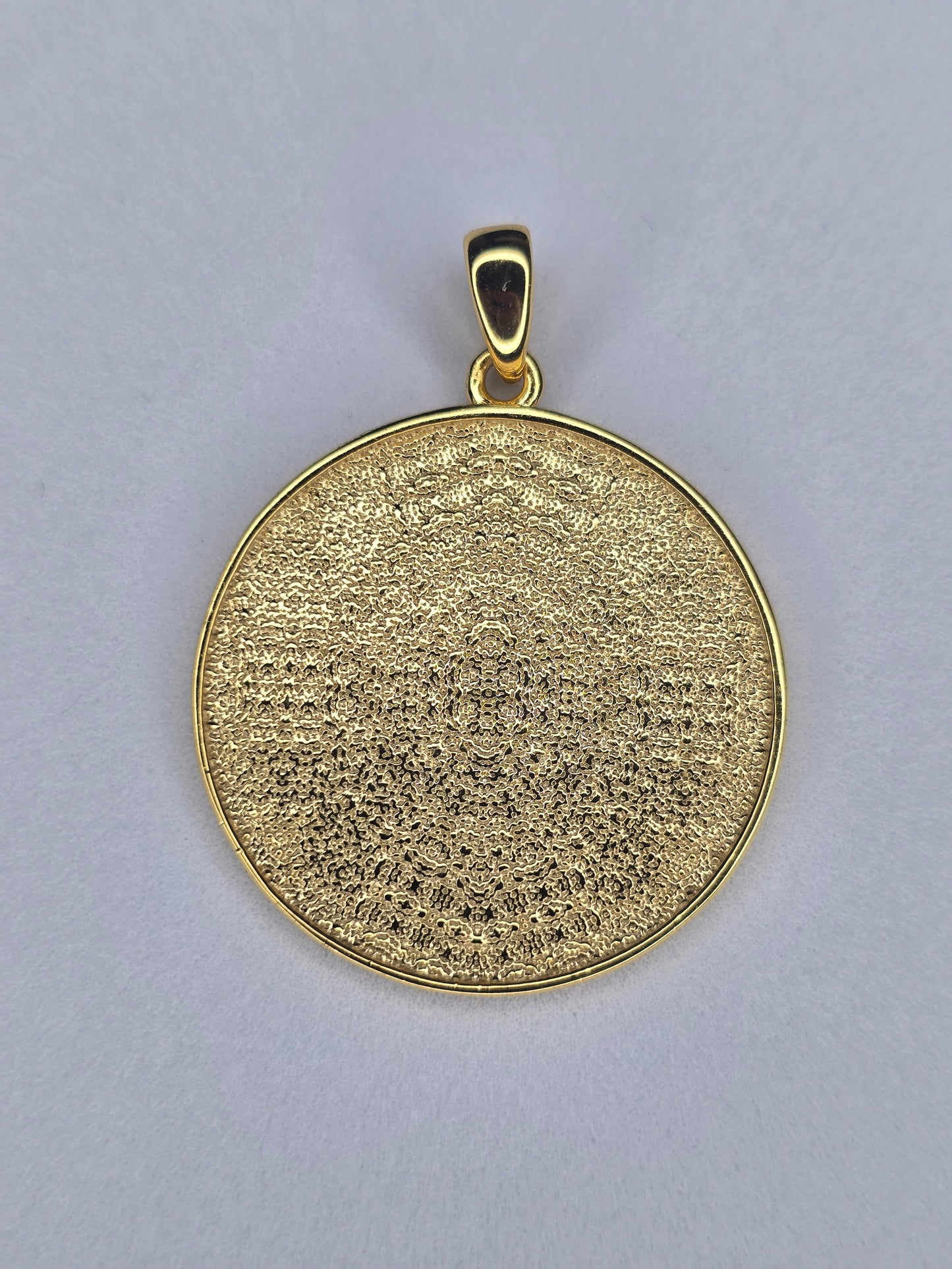 Back view of seven archangels amulet in gold plated 925 sterling silver with textured finish