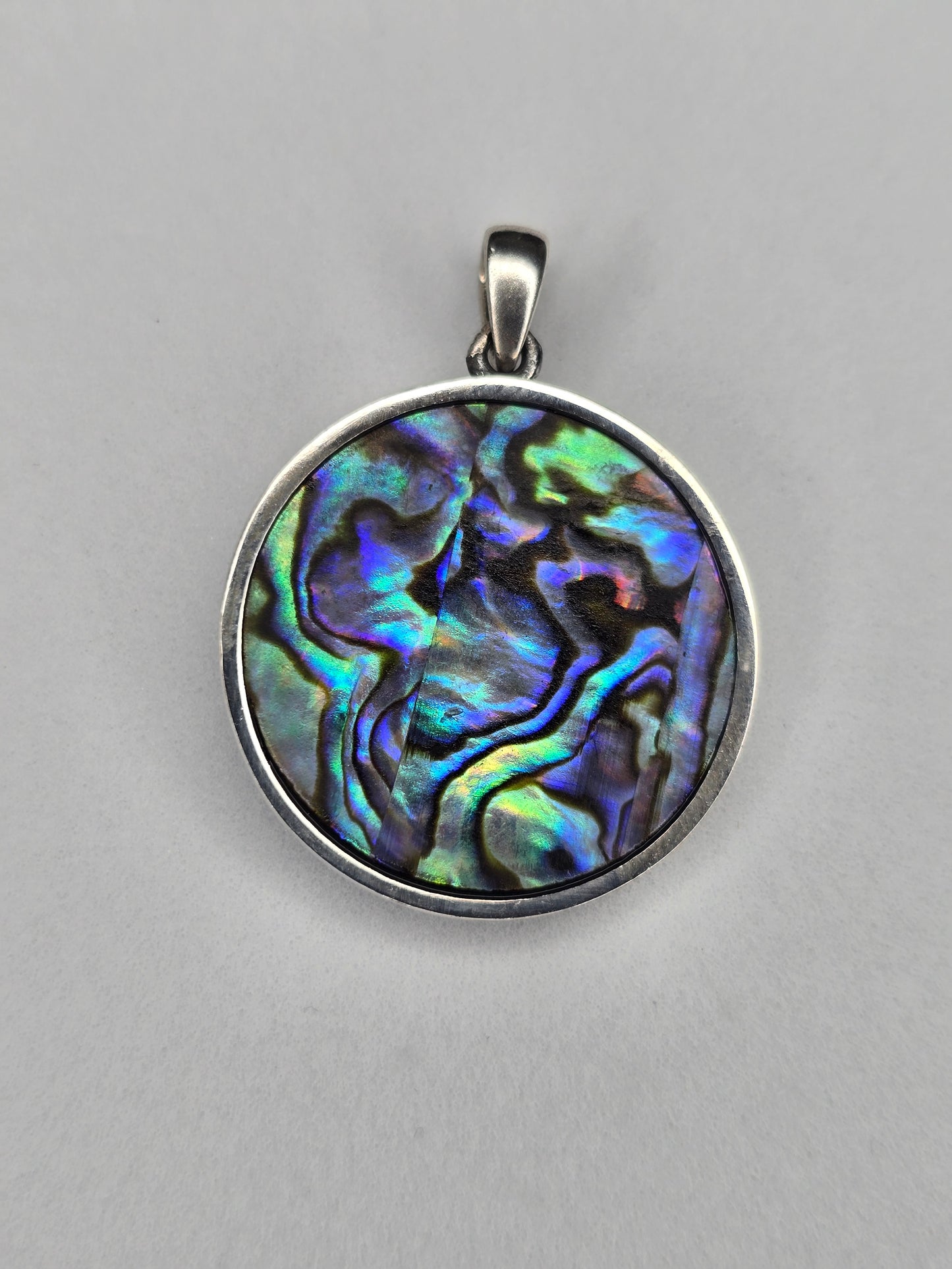 Back view of Saint Christopher silver pendant with natural abalone shell pattern