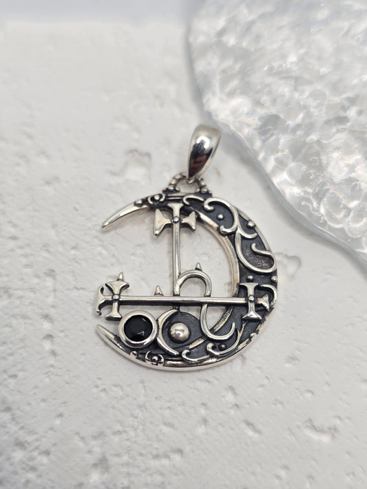 Invoke independence, intuition, and lunar mystery with the Lilith Moon Sigil Pendant, crafted in solid 925 sterling silver. A crescent moon frames Lilith’s sigil in elegant openwork, while a black gemstone at the centre adds bold contrast and dark, celestial allure. Light plays through the cutout detailing, giving the piece an ethereal, night-sky presence.

Wear it as a personal emblem of empowerment or gift it to someone who loves moon magic, folklore, and symbolic jewellery—this pendant is equal parts sta