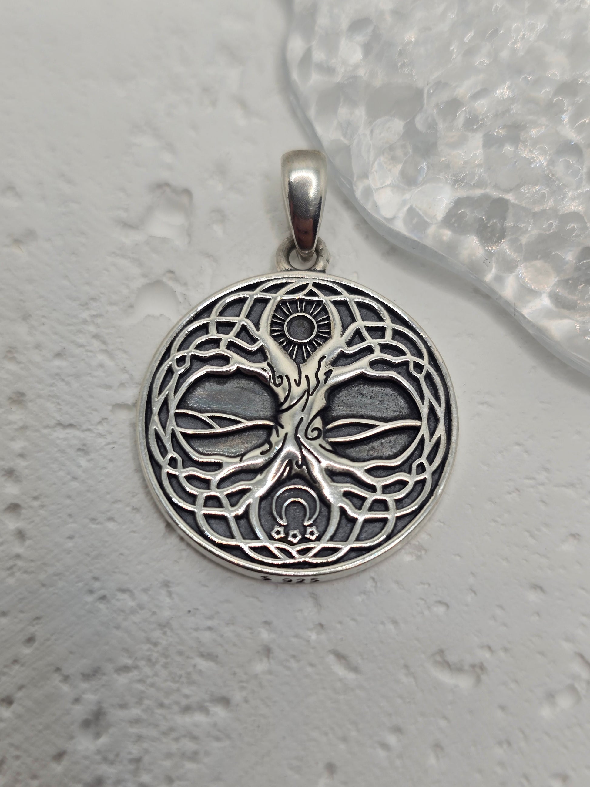 Honor ancient wisdom and connection with the Viking Yggdrasil Tree of Life Amulet, crafted in solid 925 sterling silver. Intricate branches and roots depict Yggdrasil, the sacred tree linking heaven, earth, and underworld—symbolising growth, strength, protection, and the bond between all realms. Fine engraving and a textured reverse add depth and artisan character for a meaningful, heirloom-worthy piece.

Key Features:

Made from high-quality 925 Sterling Silver
Detailed Yggdrasil (Tree of Life) motif for N
