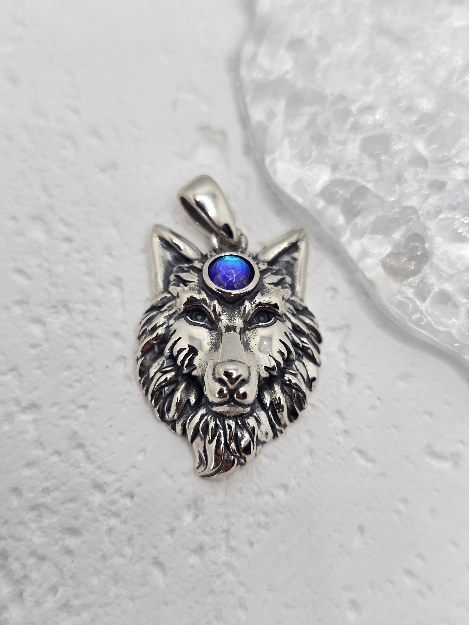 Channel strength, intuition, and lunar guidance with the Moonstone Wolf King Pendant, crafted in solid 925 sterling silver. A noble wolf head is rendered in fine detail, crowned with a luminous moonstone at the brow—symbol of insight, protection, and the rhythms of the moon.

Wear it as a daily talisman of leadership and courage, or gift it to someone who walks with the spirit of the wolf. Balanced proportions and crisp detailing give this piece a powerful, elegant presence.

Key Features:

Made from solid 