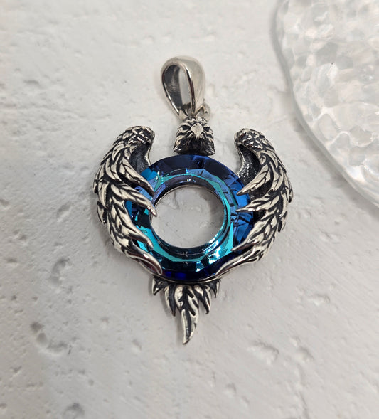 Channel strength, freedom, and clarity with the Eagle Wings Amulet, crafted in luminous 925 sterling silver and set with a deep blue Austrian crystal. Finely sculpted wings frame the radiant centre stone, creating a bold talisman that elevates everyday style and meaningful gifting.

Key Features:

Made from solid 925 Sterling Silver
Eagle wing motif symbolising power, freedom, and vision
Blue Austrian crystal centre for vibrant sparkle and depth
Polished detailing with light-catching feather texture
Ideal s