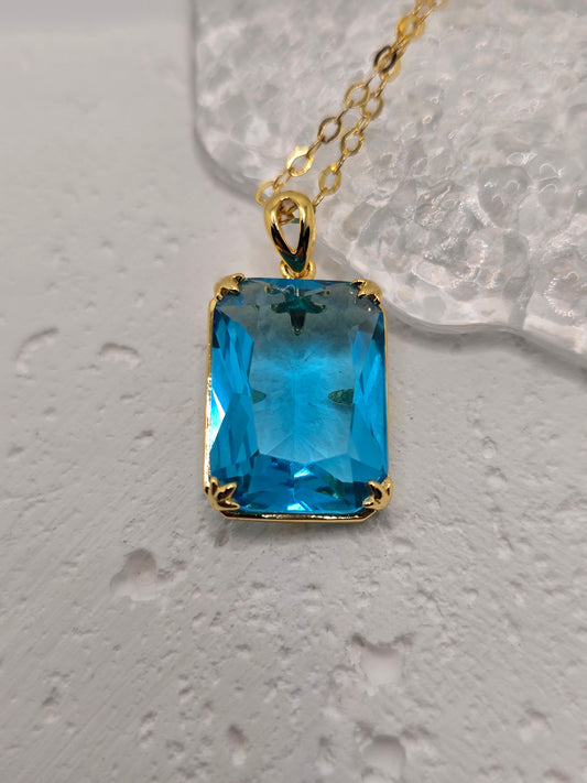 Bring bold, Nordic-inspired style to your look with this Blue Topaz Viking Pendant, crafted in luminous 925 sterling silver with refined 14K gold accents—complete with a 45 cm sterling silver chain. A vivid blue topaz centres the design for calm, sky-blue brilliance, while VVS-grade clear stones (CZ) add crisp sparkle from every angle. Compact yet eye-catching, it’s a unique gift for birthdays, anniversaries, or weddings.

Key Features

Made from premium 925 Sterling Silver with 14K gold accents
Centre blue