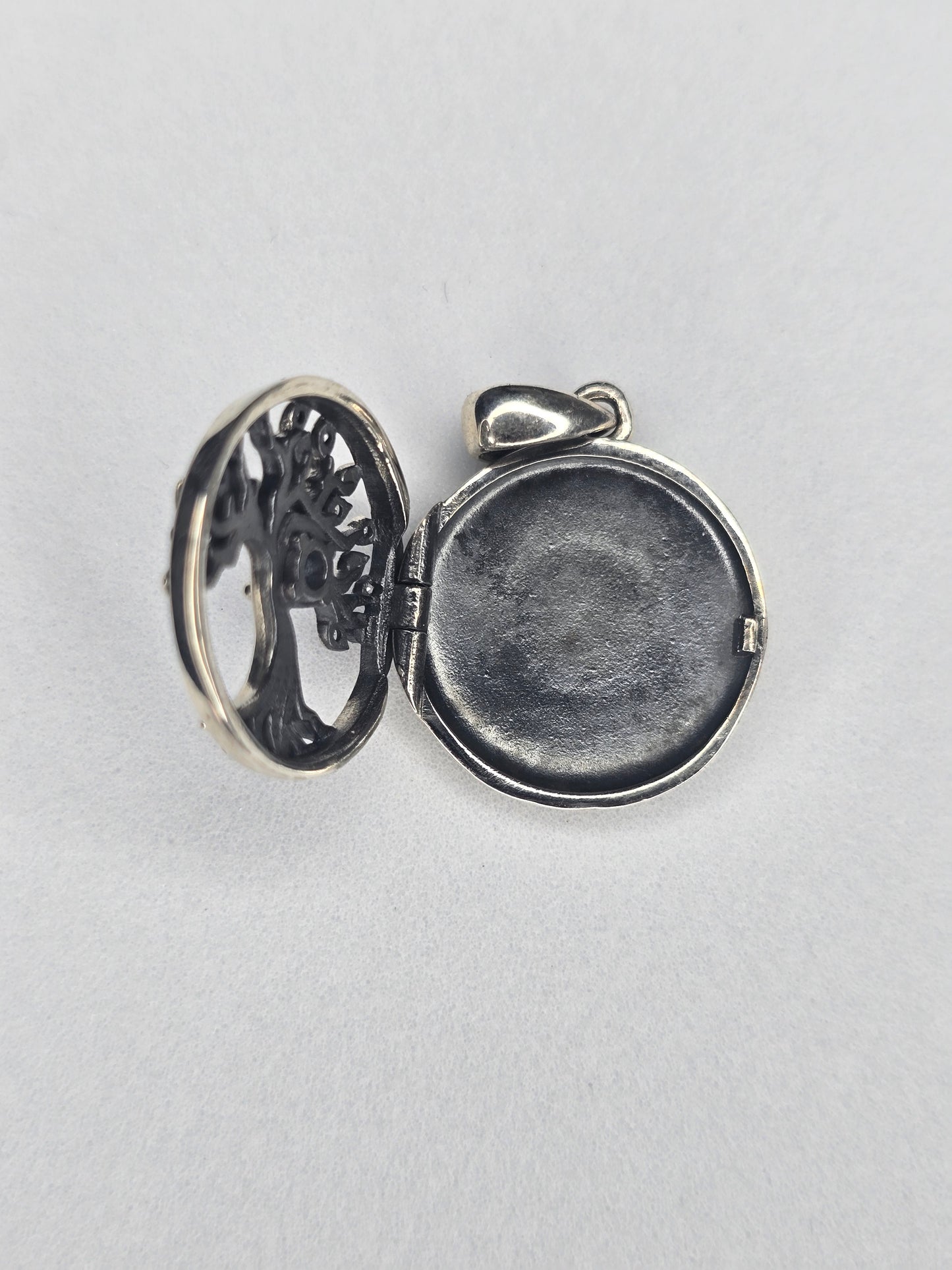 Open Tree of Life silver photo locket showing inner photo compartment
