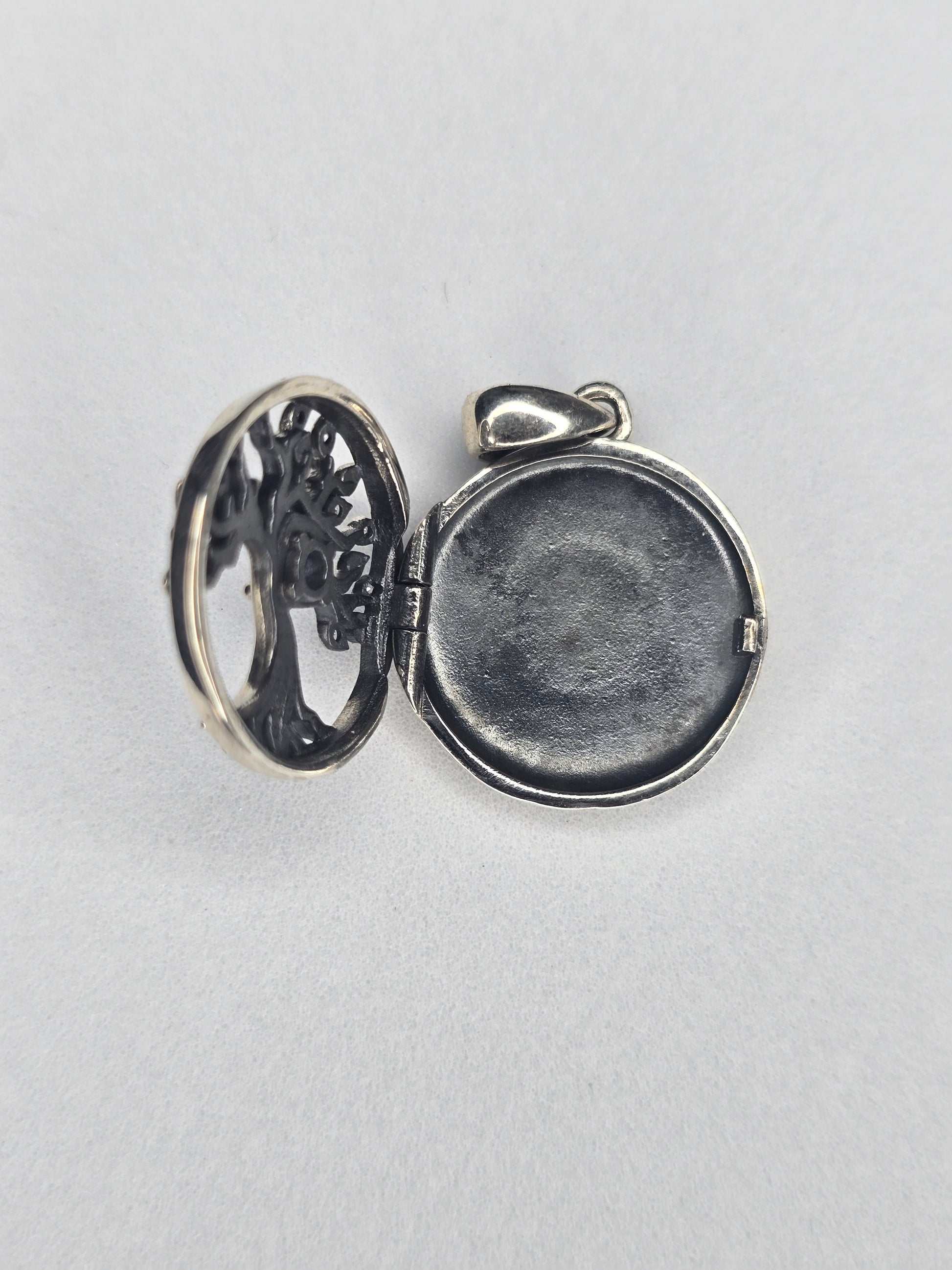 Open Tree of Life silver photo locket showing inner photo compartment