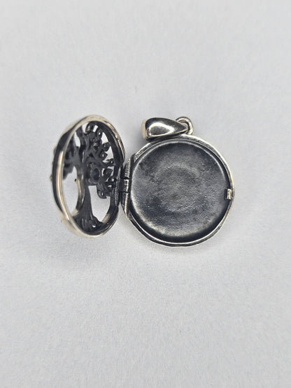 Open Tree of Life silver photo locket showing inner photo compartment