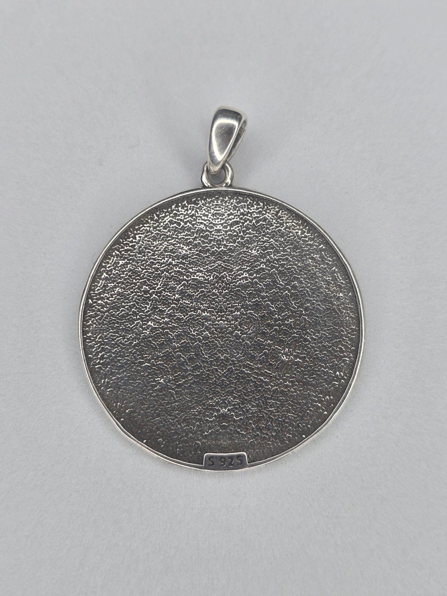 Back view of Seven Archangels sterling silver pendant with textured finish and 925 hallmark