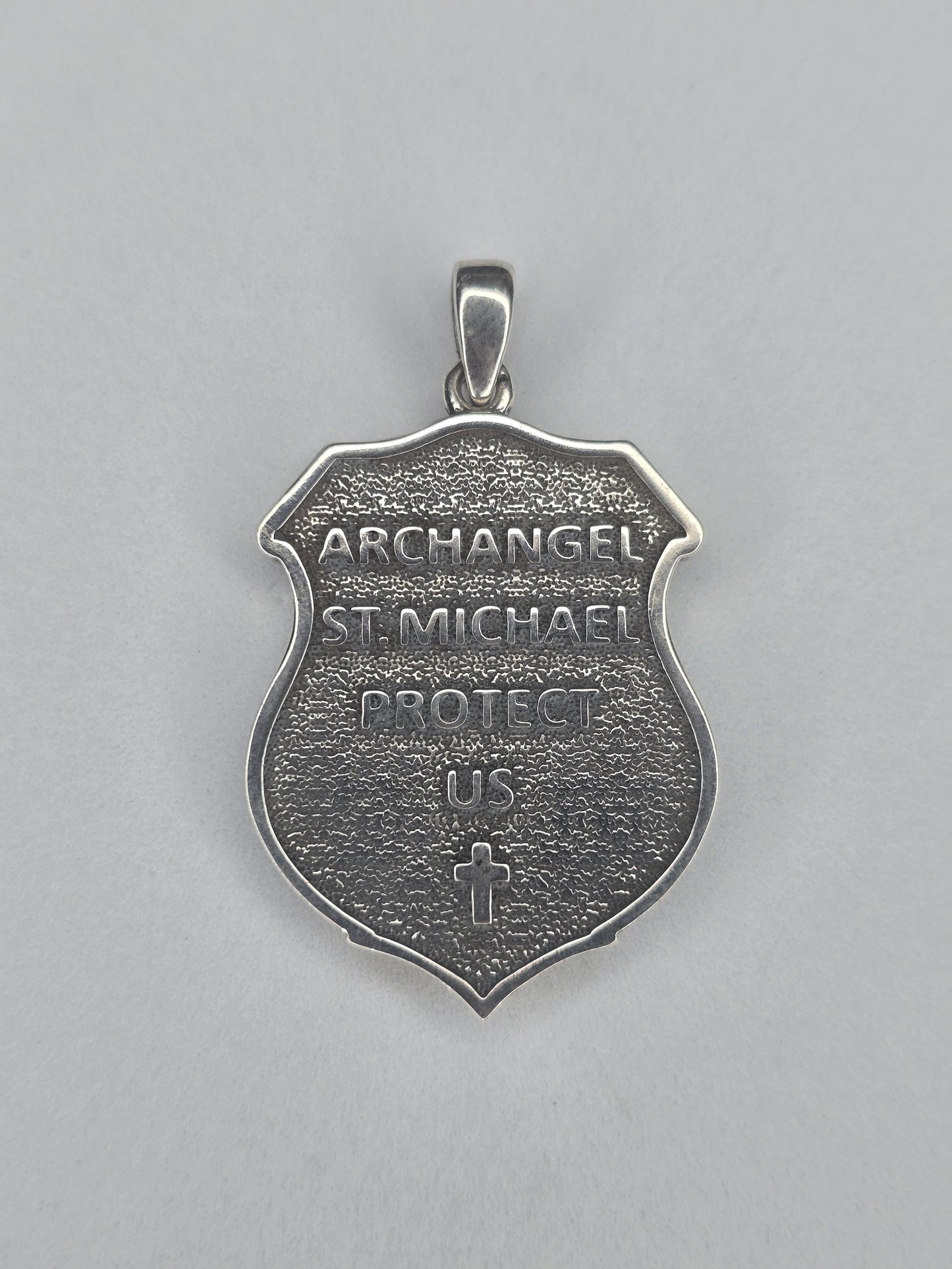 Back view of Saint Michael shield amulet with engraved Archangel inscription