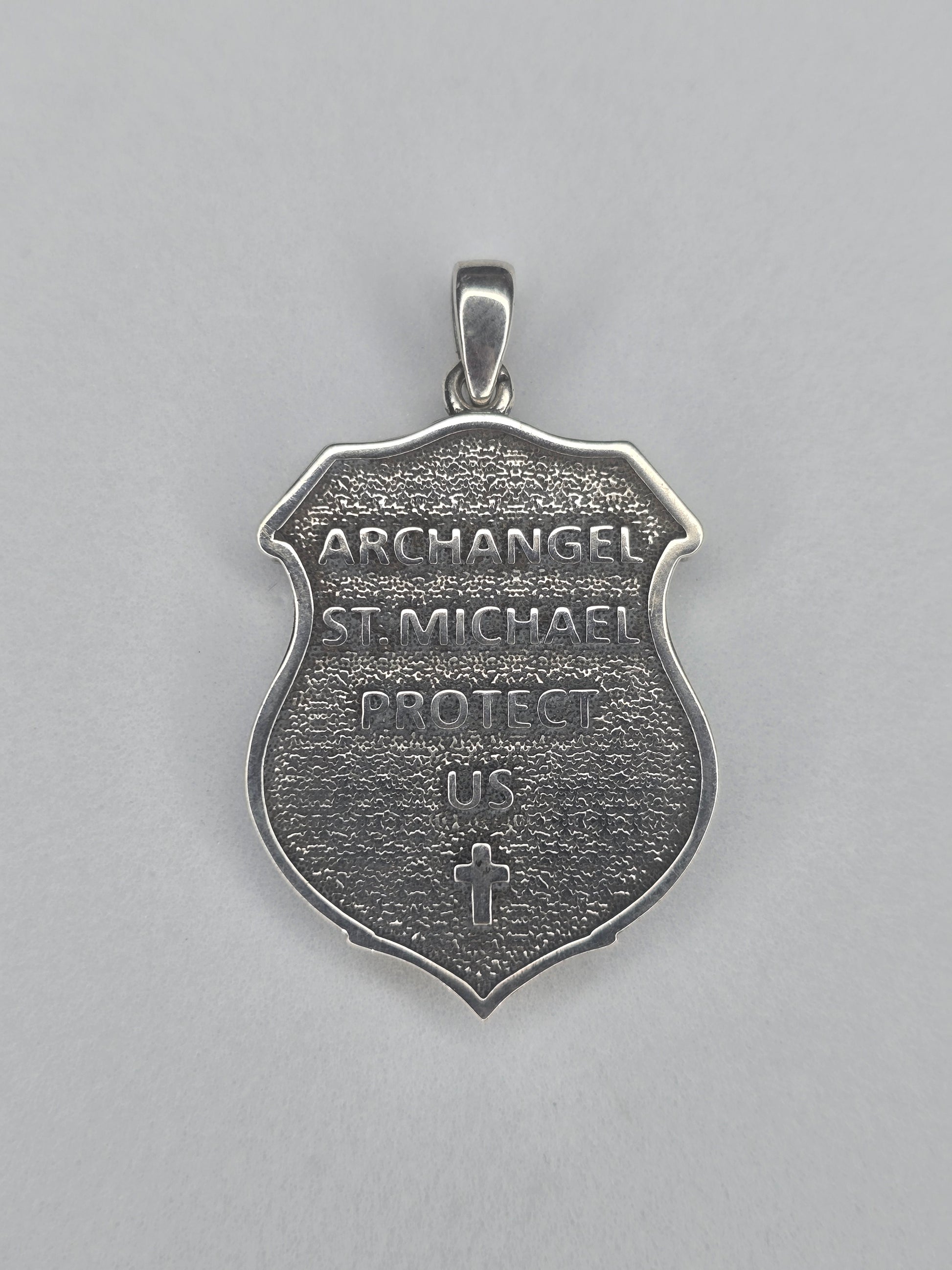 Back view of Saint Michael shield amulet with engraved Archangel inscription
