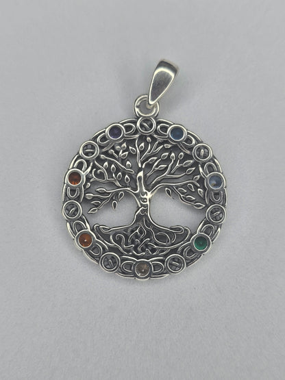 Back view of sterling silver Tree of Life chakra pendant with polished circular frame and hallmark