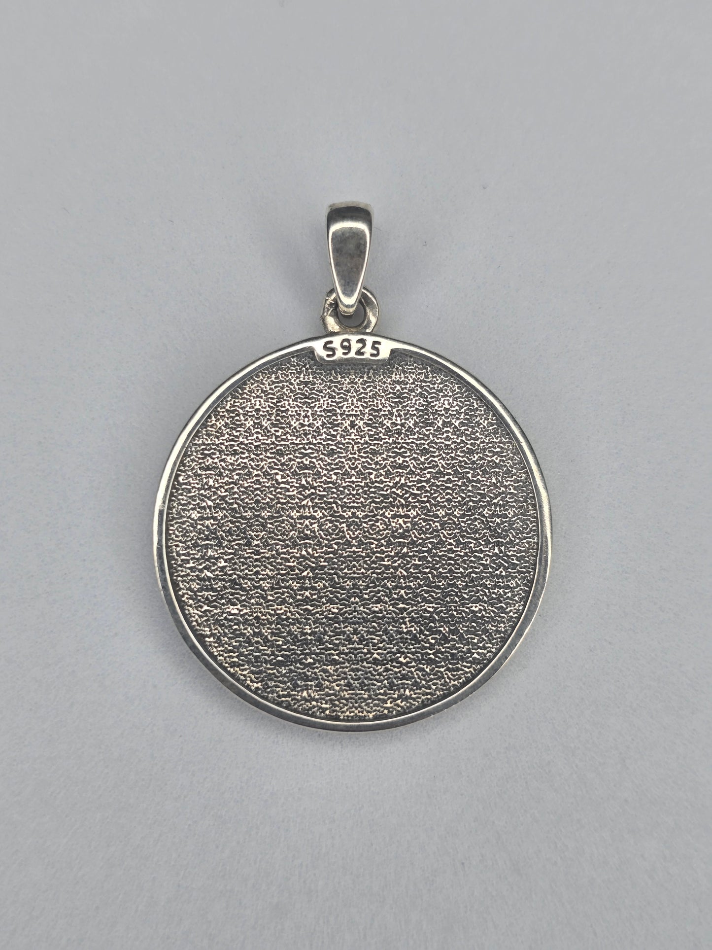 Back view of Hecate pagan pendant with textured sterling silver finish