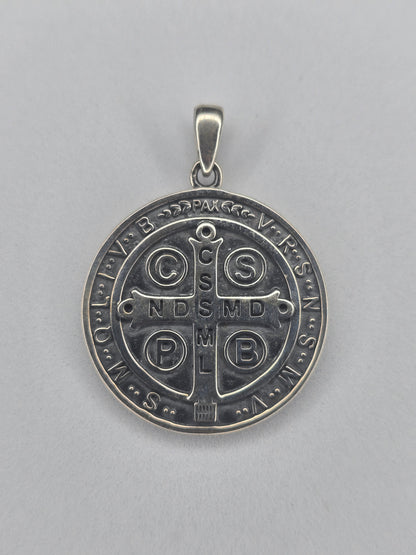 Back view of Saint Benedict cross pendant in sterling silver with engraved sacred symbols