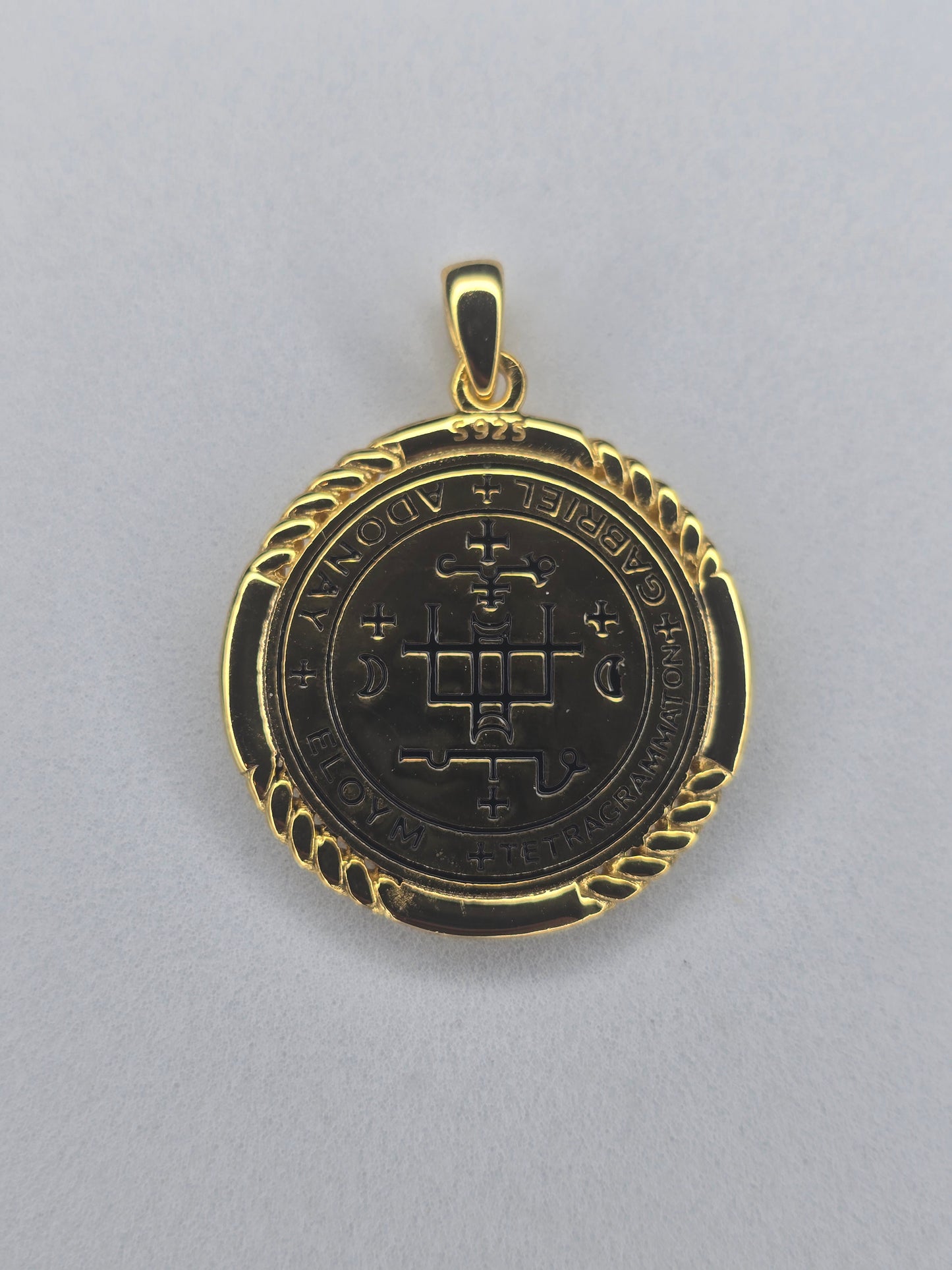 Back view of Saint Gabriel medal with engraved angelic seal and sacred symbols