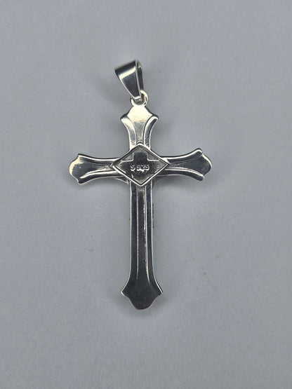 Back view of sterling silver crucifix pendant with smooth finish and S925 hallmark