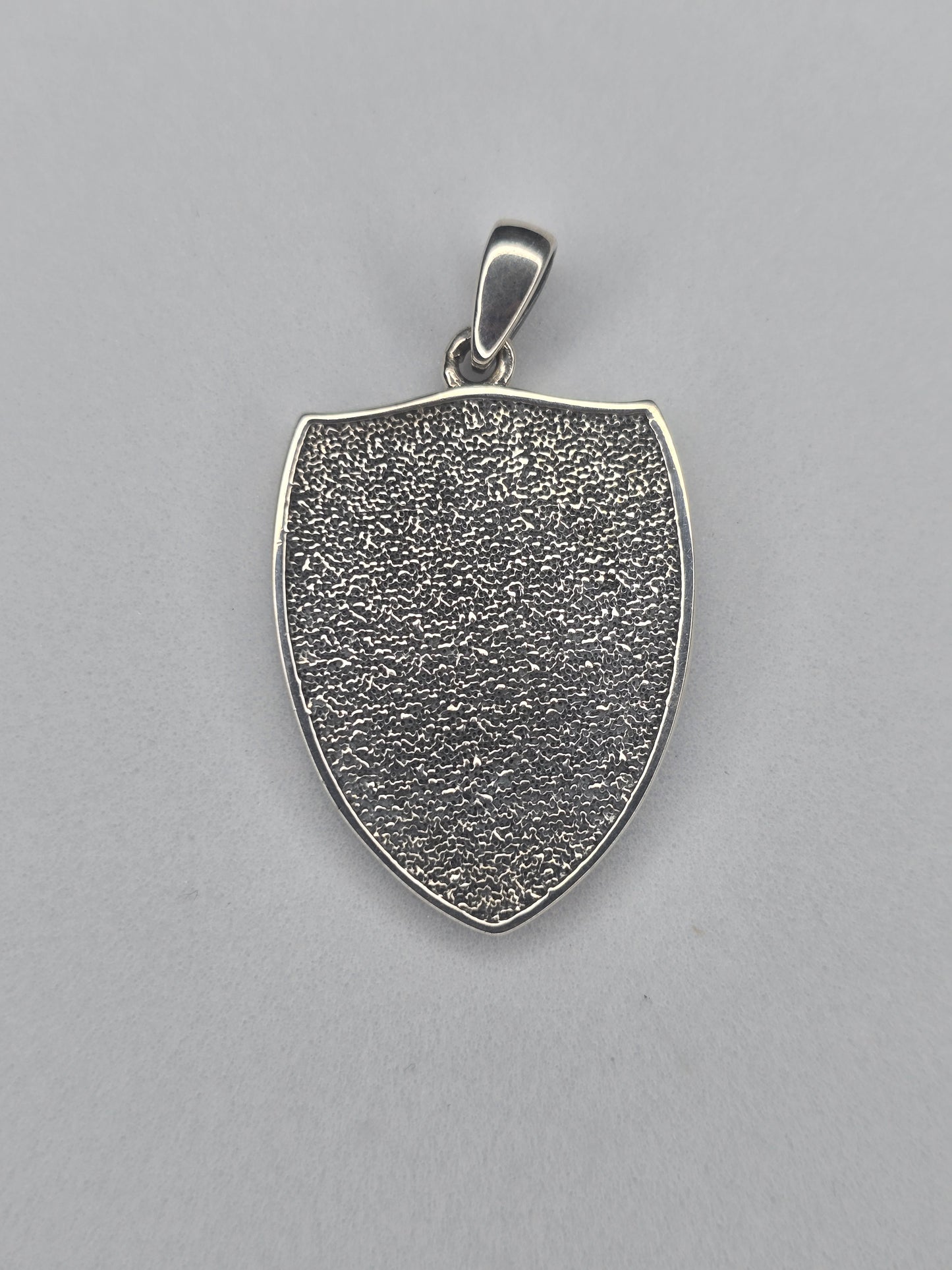 Back view of Triple Moon Goddess shield pendant in 925 sterling silver with textured finish