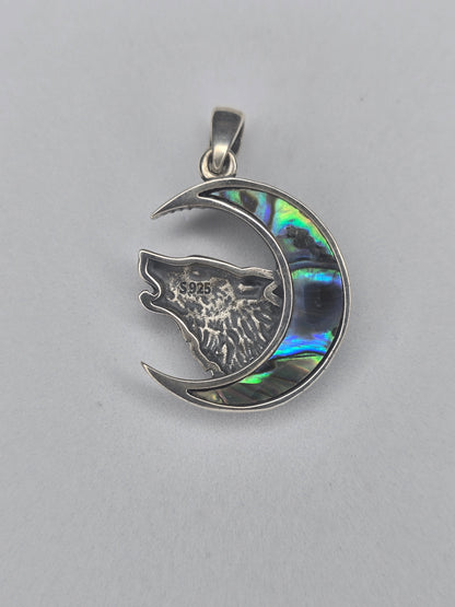 Back view of sterling silver wolf moon pendant with textured finish and 925 hallmark