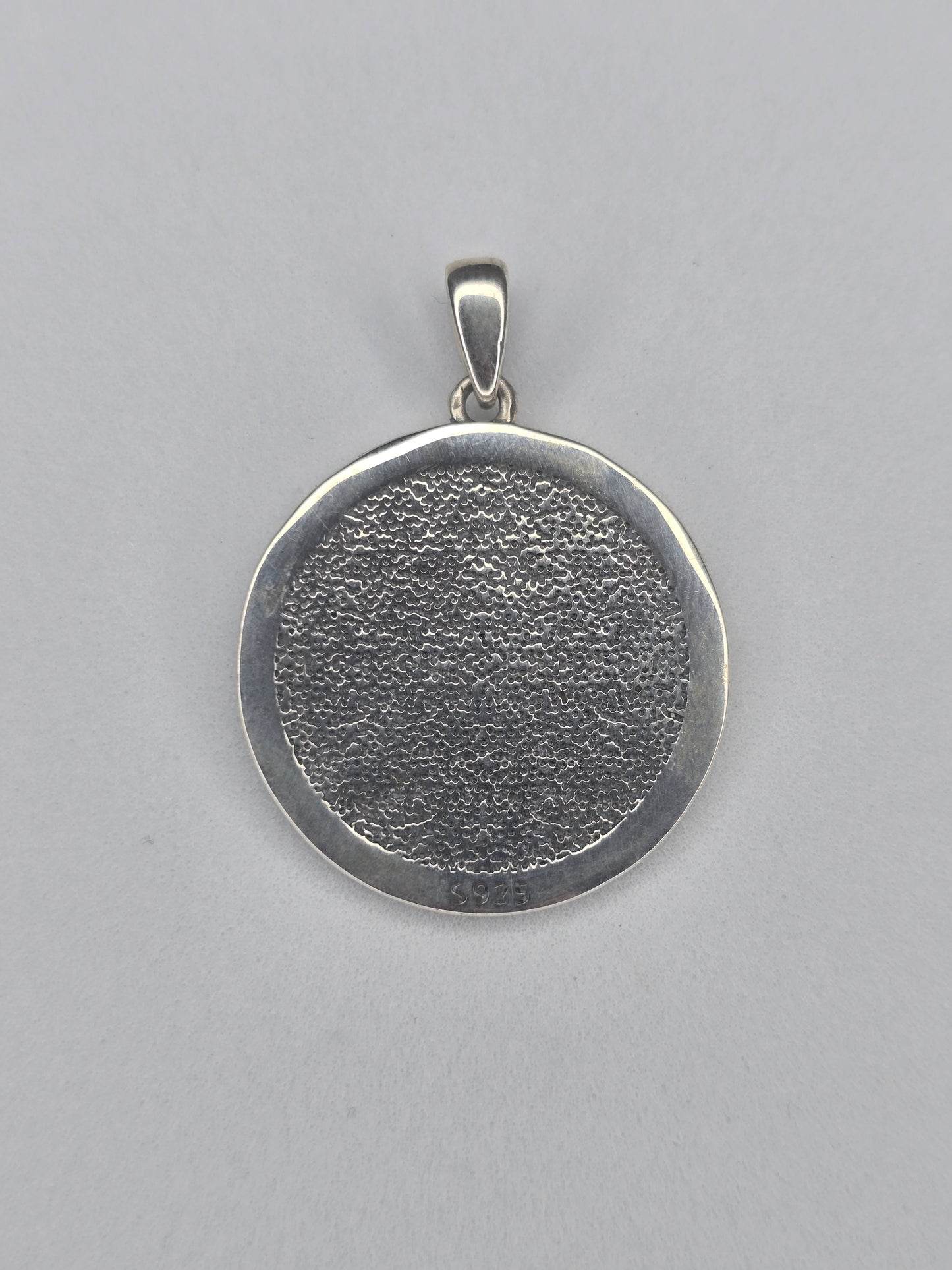 Back view of sterling silver Ankh pendant with textured circular finish and 925 hallmark