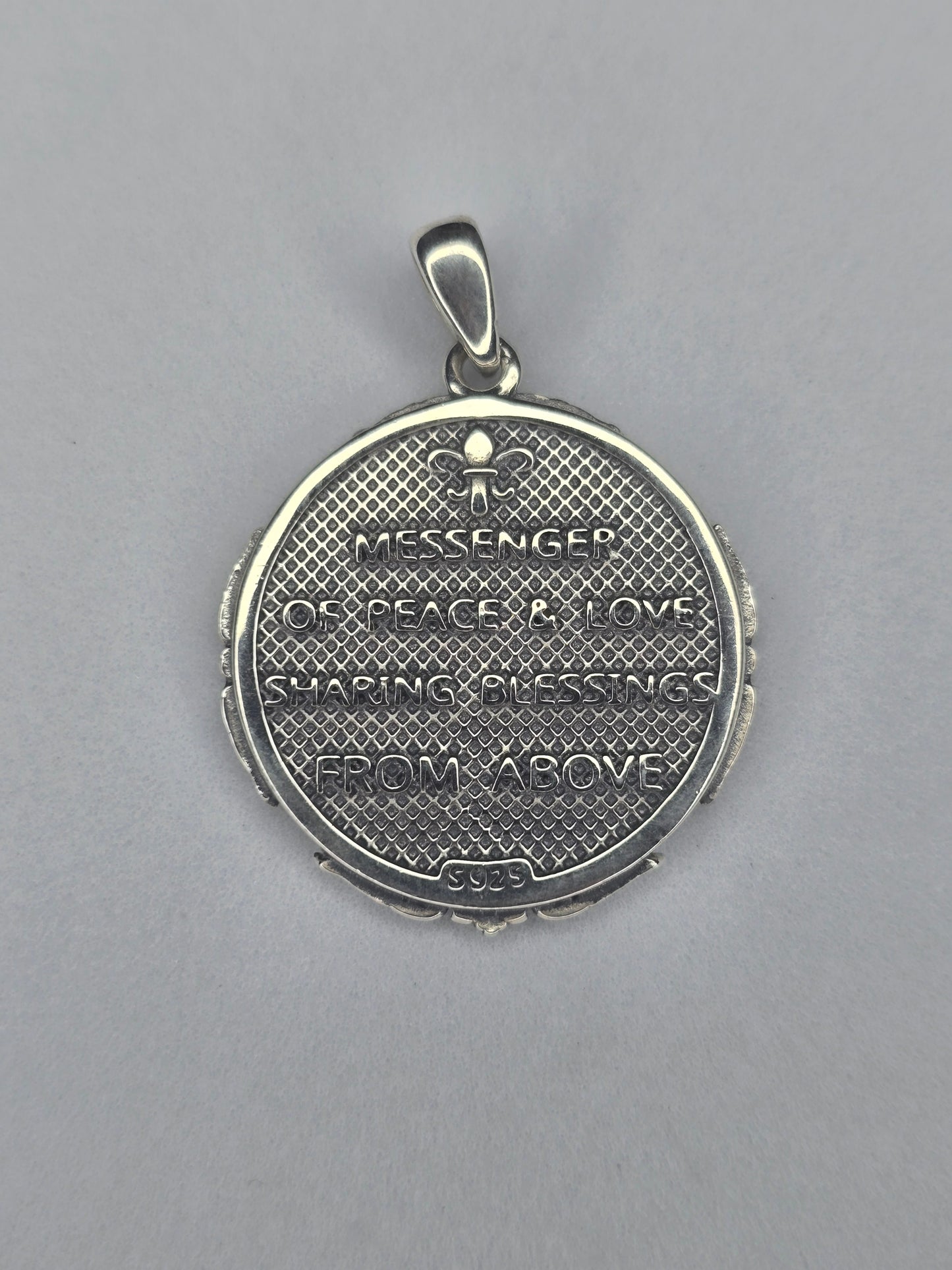 Back view of Saint Gabriel medal with Messenger of Peace and Love engraving