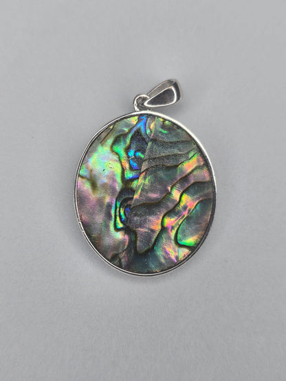 Back view of sterling silver Saint Michael pendant with natural abalone shell texture