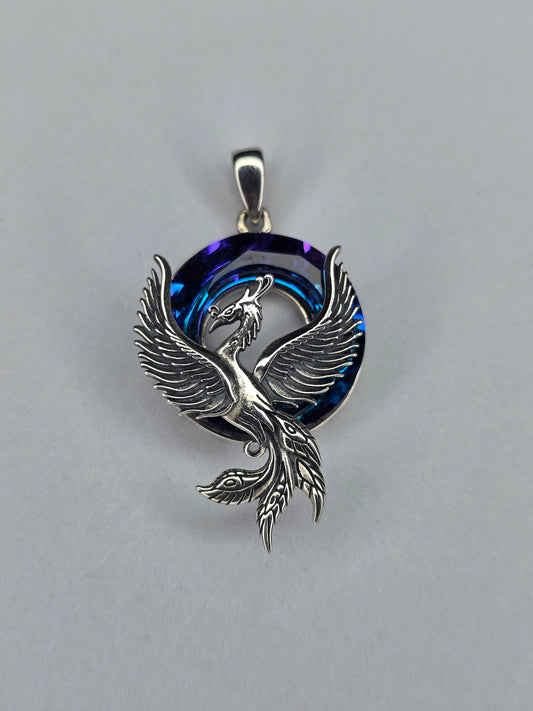 Phoenix Rising pendant in solid 925 sterling silver with blue crystal circular halo