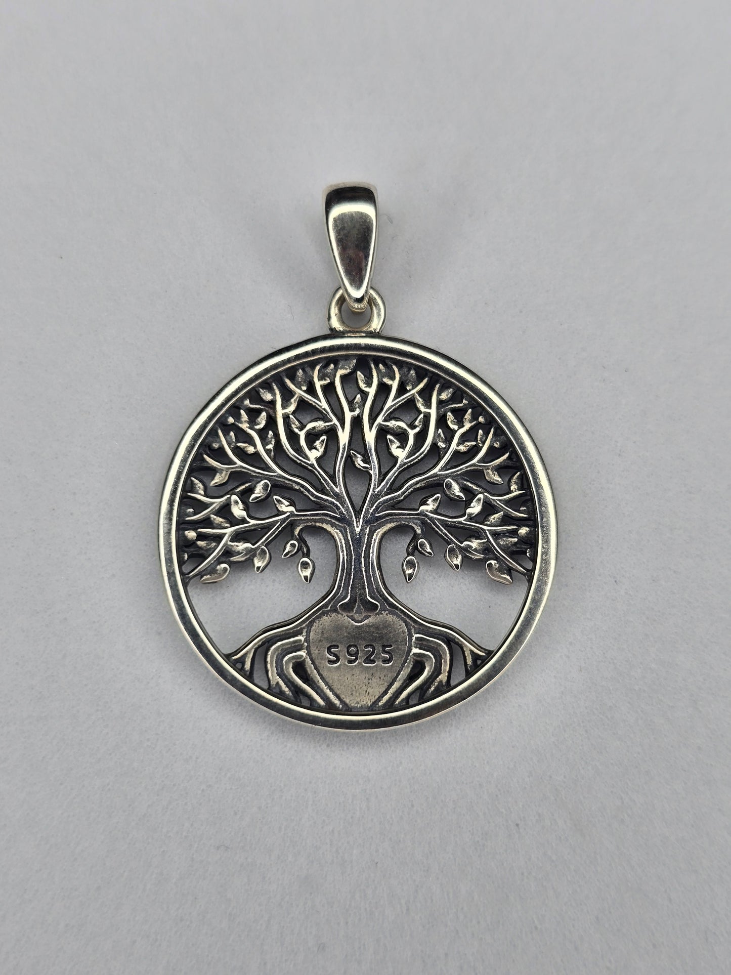 Back view of sterling silver Tree of Life heart pendant with openwork design and 925 hallmark