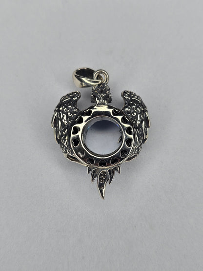 Back view of silver eagle wings pendant with open crystal setting