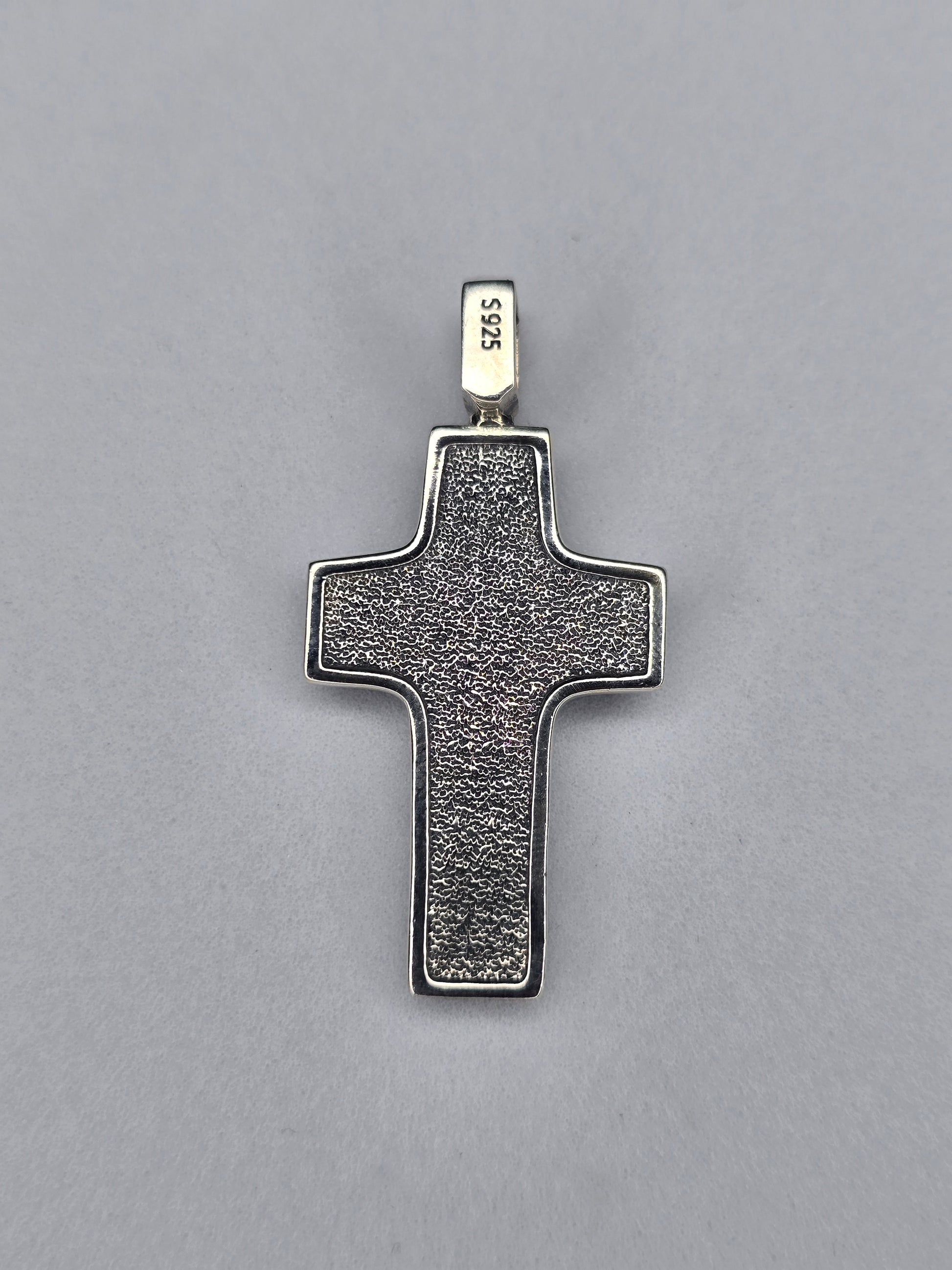 Back view of sterling silver Jesus crucifix cross pendant with textured surface