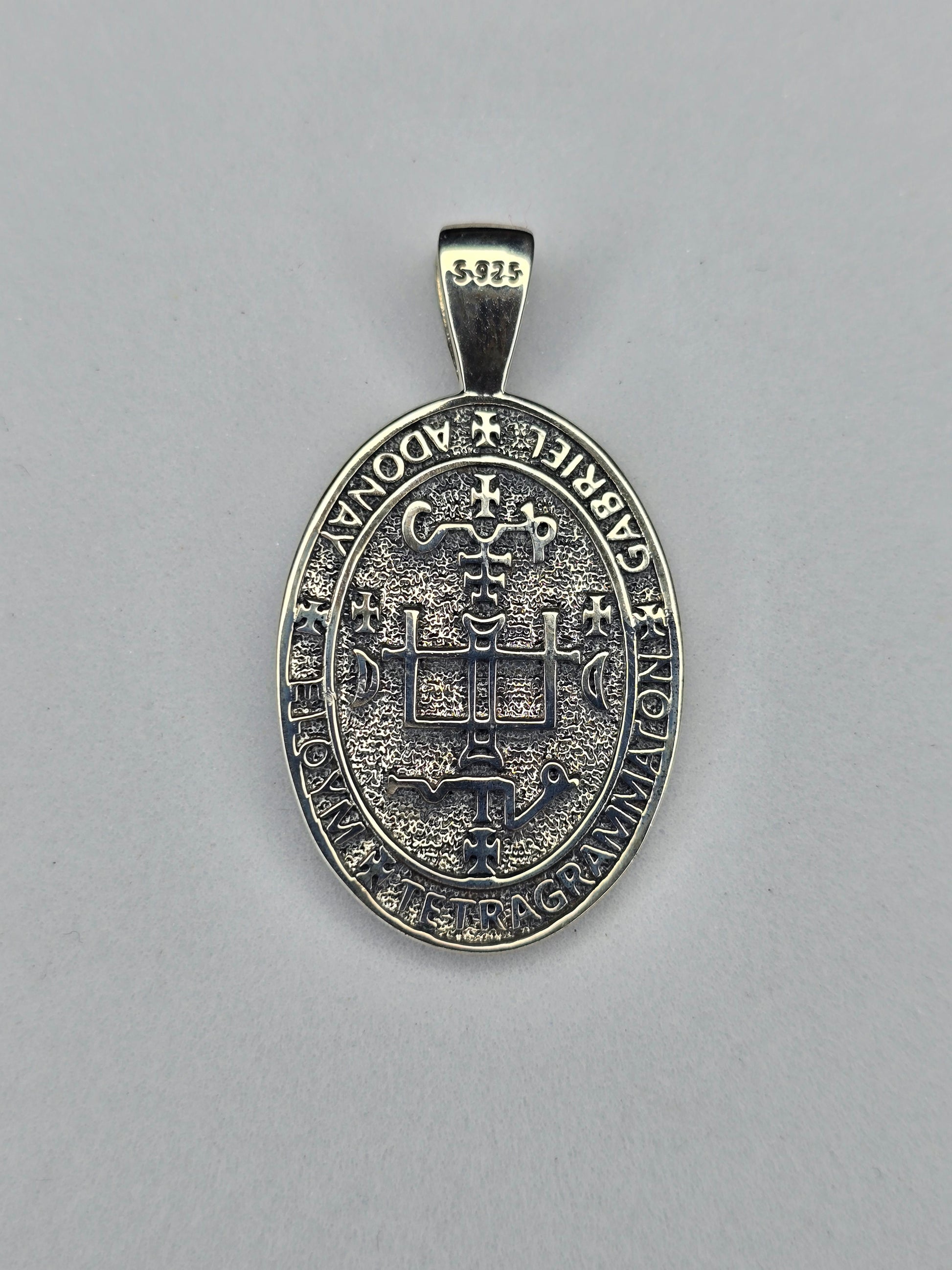 Back view of Saint Gabriel religious medal with cross and symbolic inscription in sterling silver