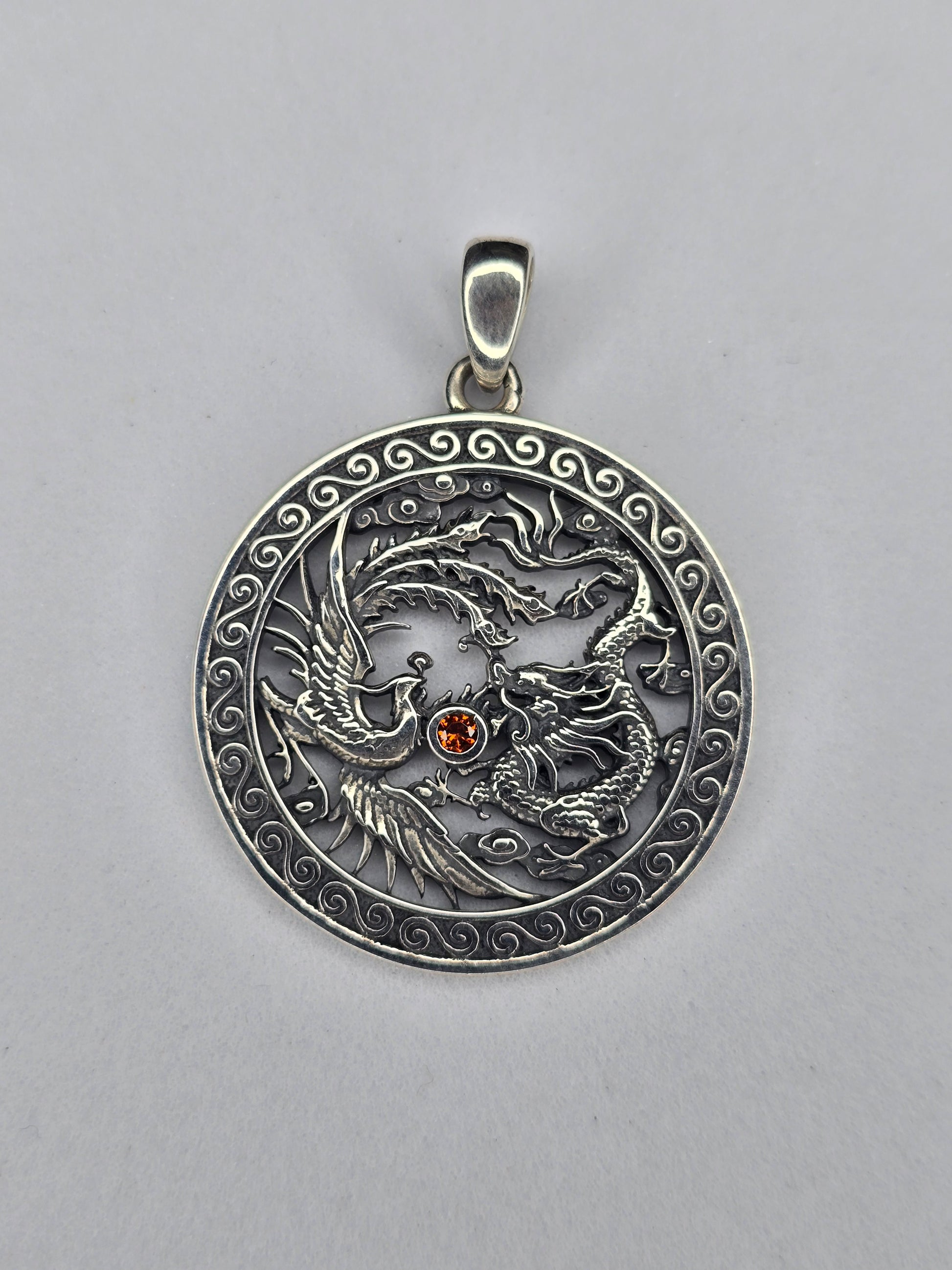 Phoenix and dragon yin yang pendant in 925 sterling silver with ruby centre
