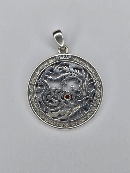 Back view of phoenix dragon sterling silver pendant with textured finish