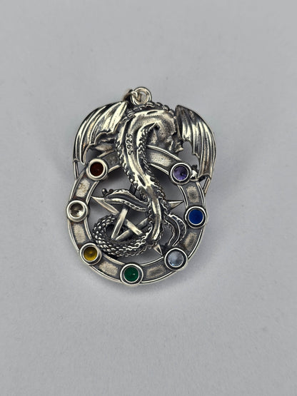 Back view of sterling silver dragon pentagram pendant showing detailed relief and hallmark