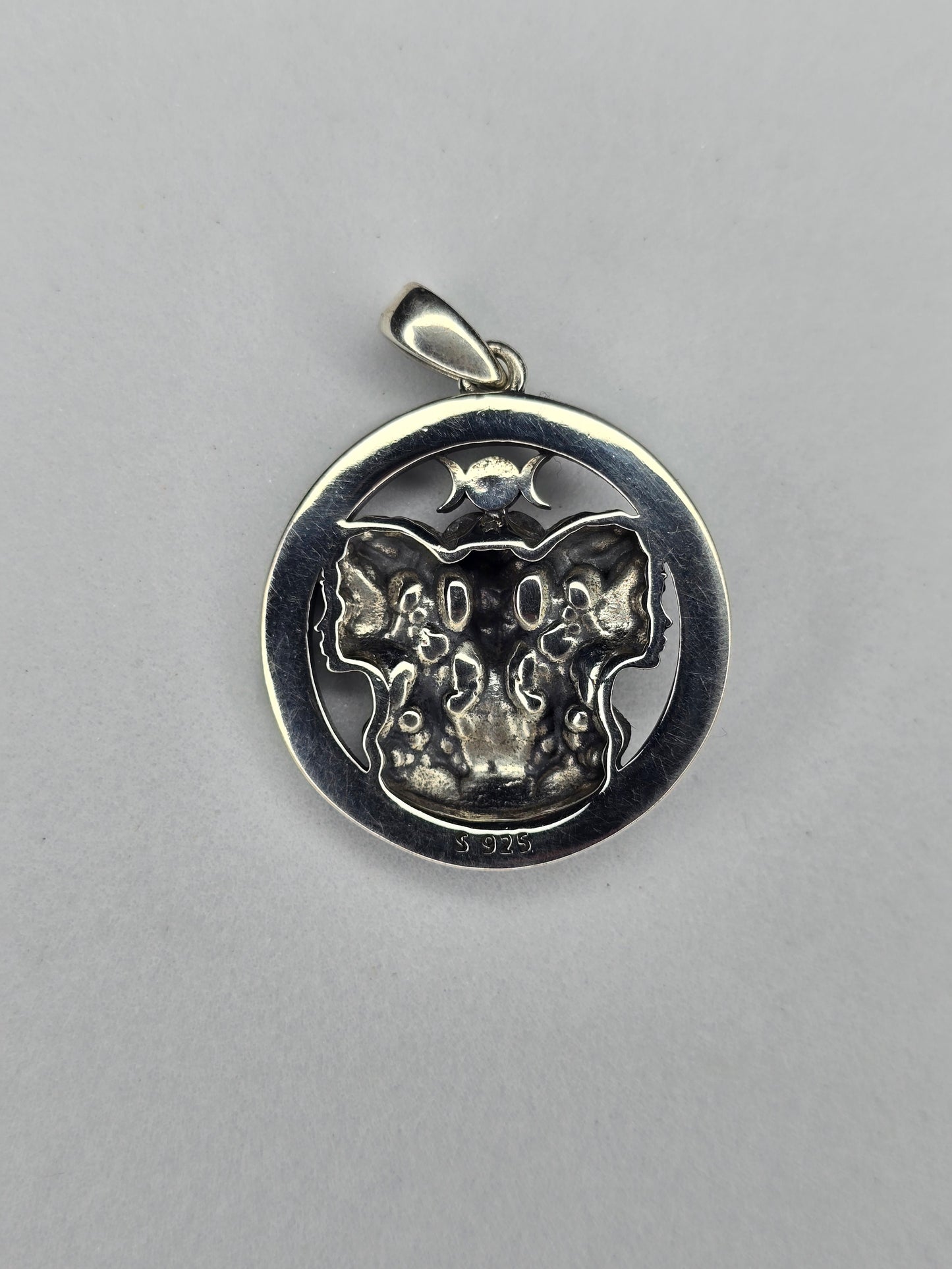 Back view of Triple Moon Goddess pendant with textured sterling silver finish