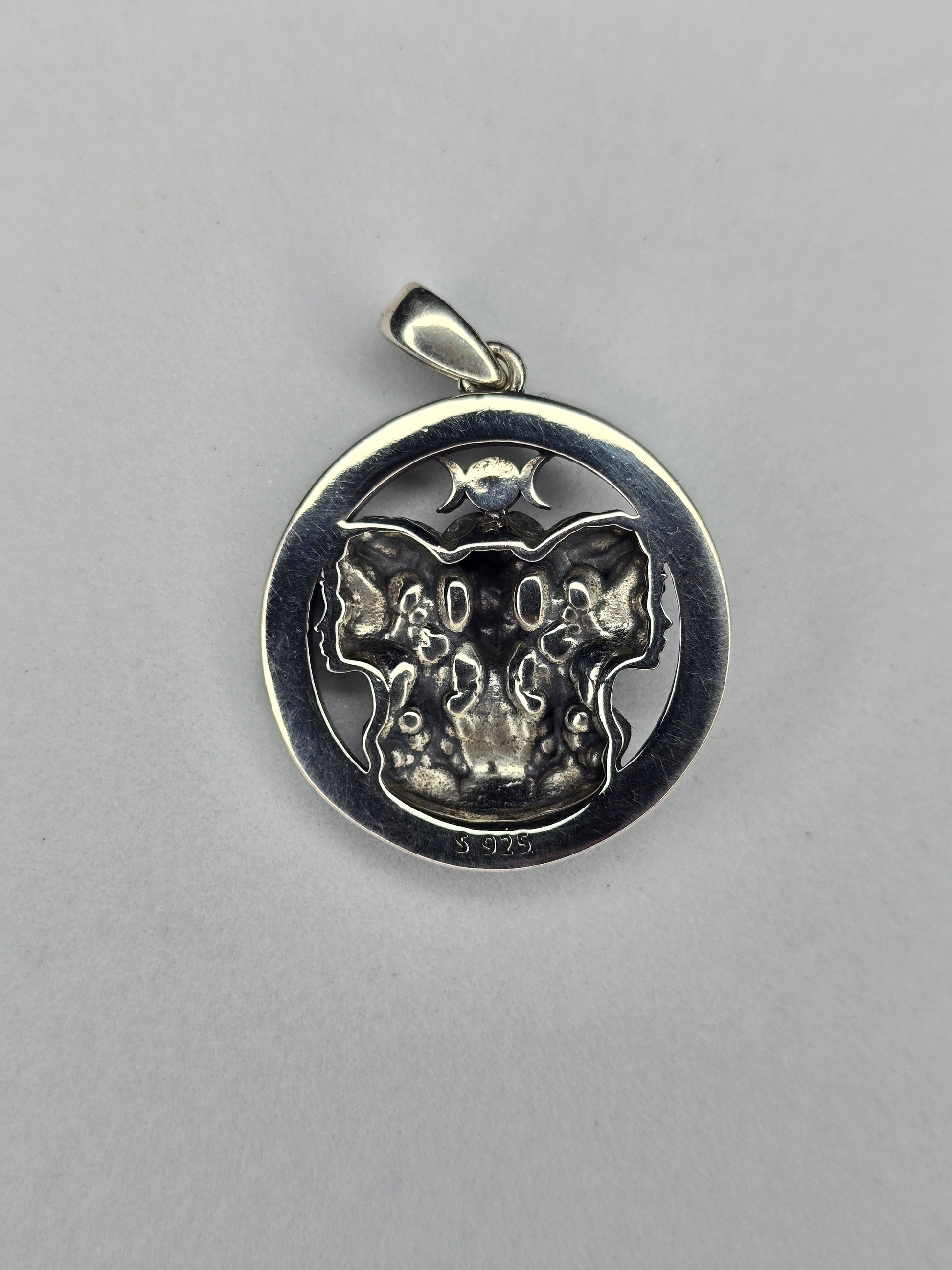 Back view of Triple Moon Goddess pendant with textured sterling silver finish
