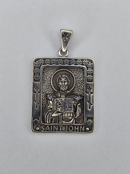Saint John pendant in solid 925 sterling silver with engraved saint holding scripture