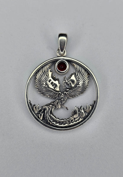Back view of sterling silver phoenix pendant with open circular design