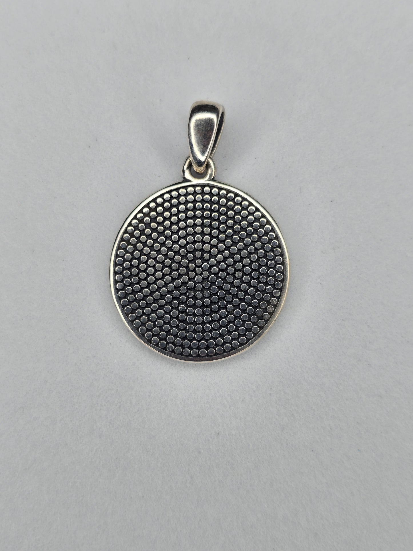 Back view of Tree of Life rune pendant with textured sterling silver surface