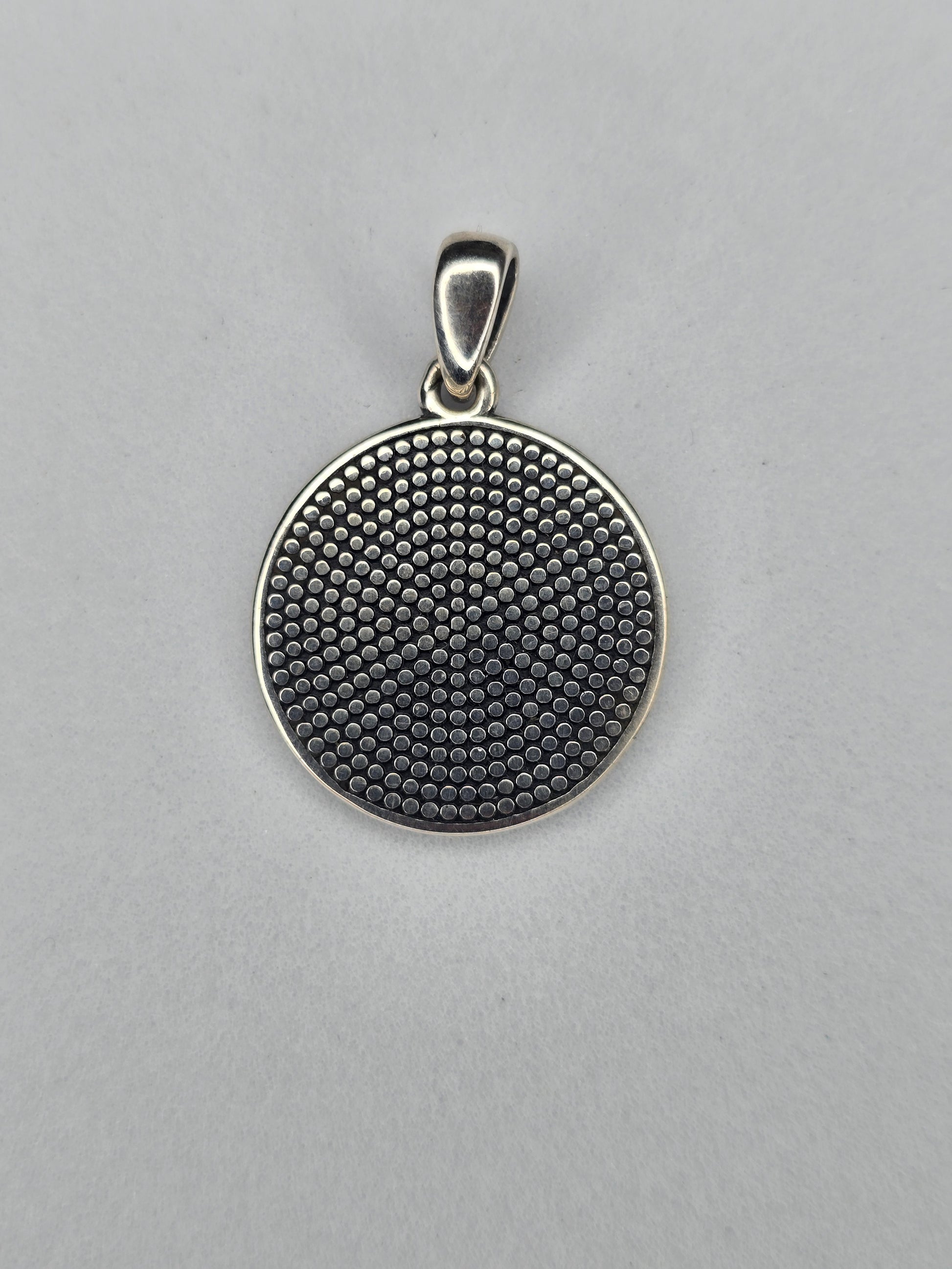 Back view of Tree of Life rune pendant with textured sterling silver surface