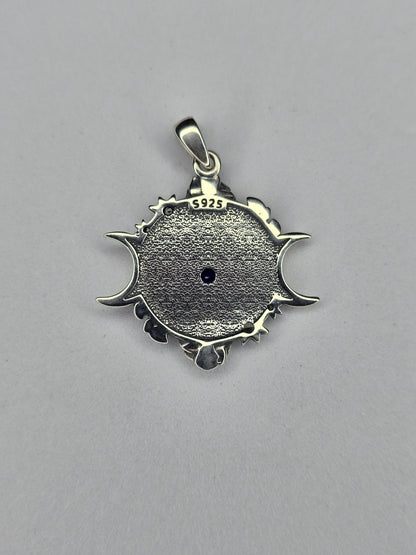 Back view of Eye of Horus triple moon pendant showing textured sterling silver finish