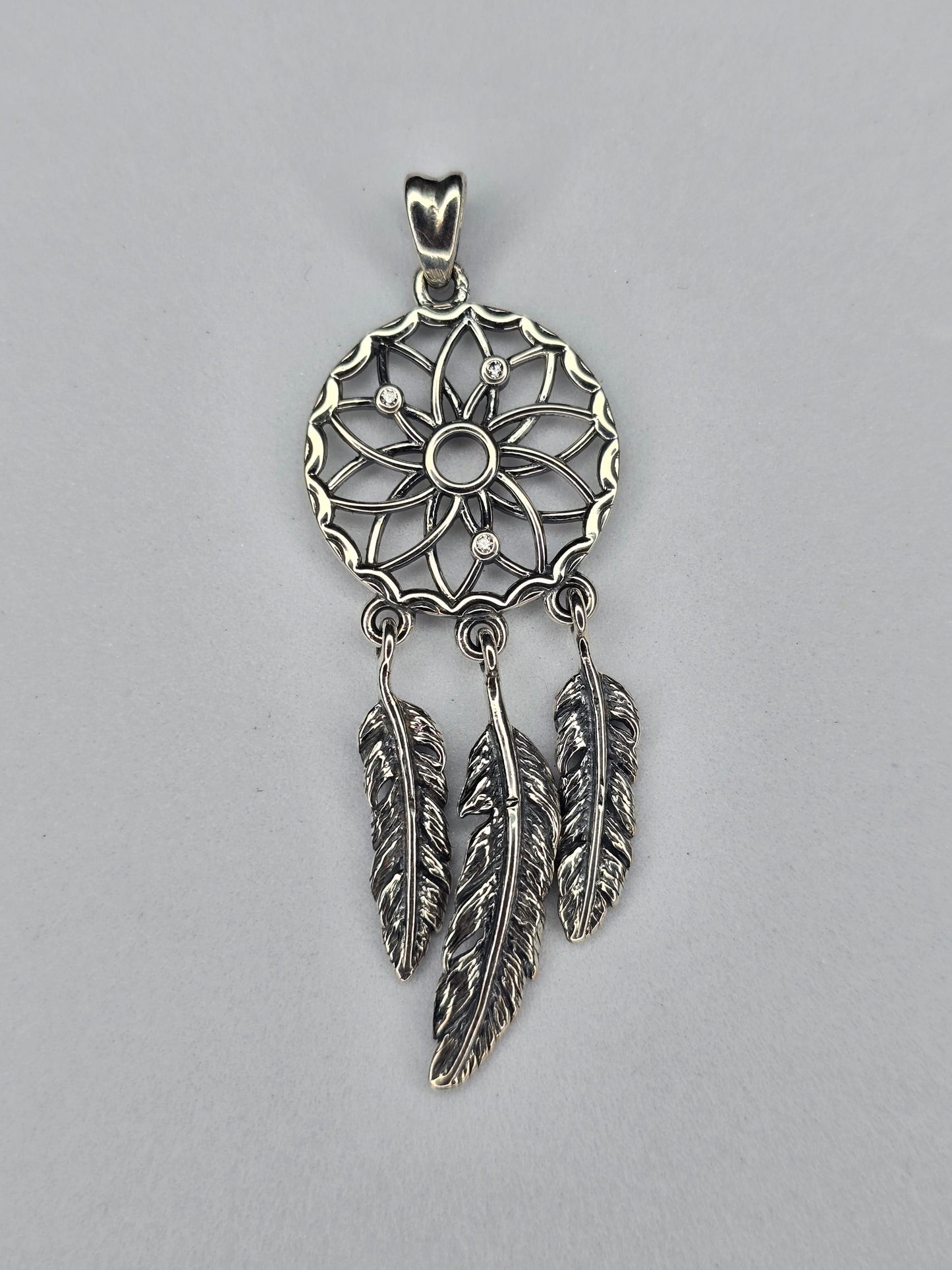 Dream catcher pendant in solid 925 sterling silver with openwork web and feather drops