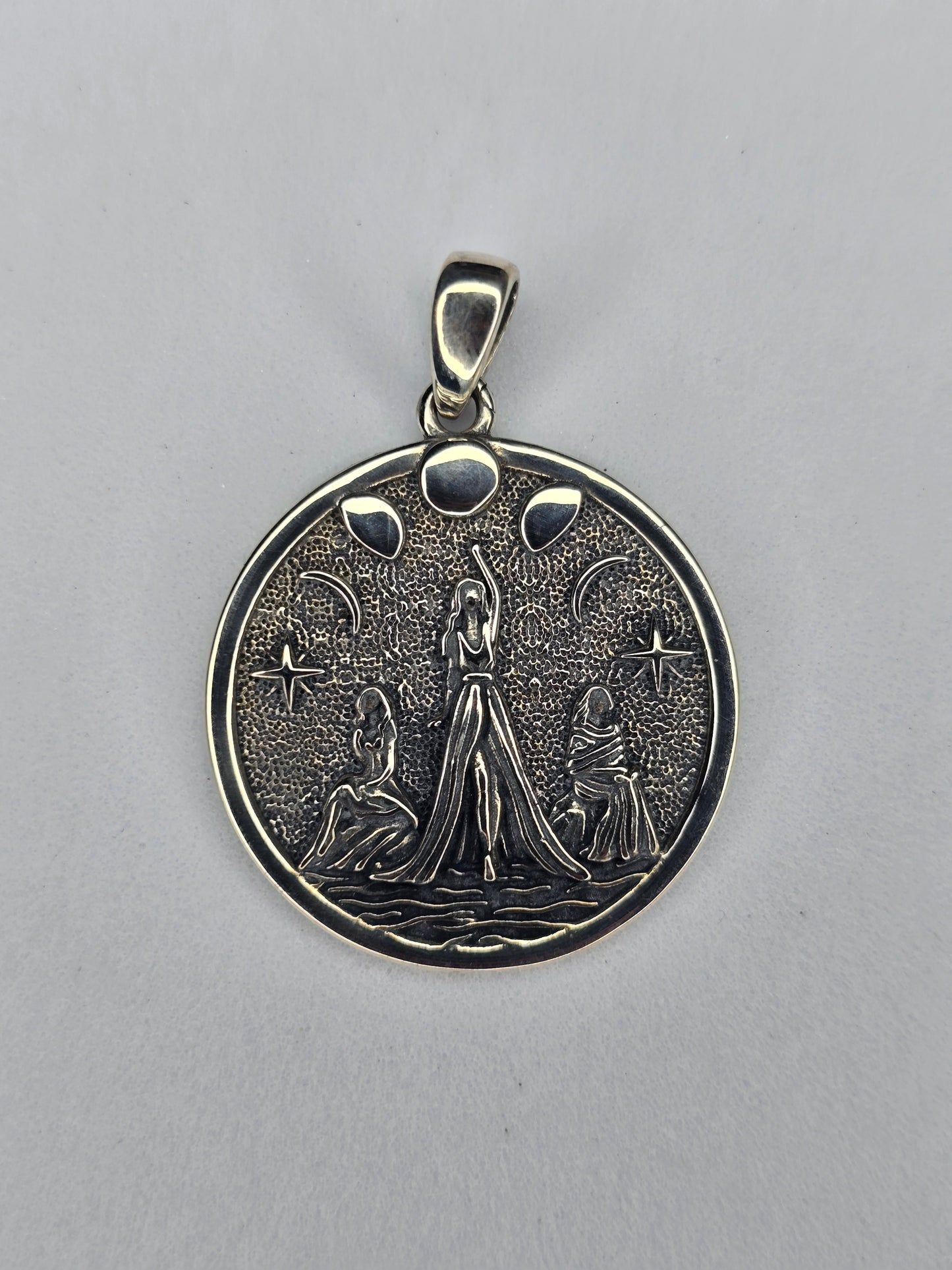 Triple Goddess pendant in solid 925 sterling silver with lunar phases and textured night-sky background
