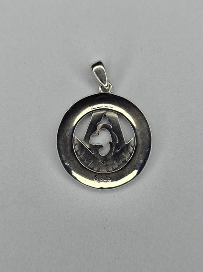 Back view of sterling silver Freemason pendant with circular polished frame and hallmark