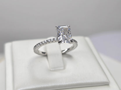 Crushed ice cut zircon ring in 925 sterling silver showing radiant main stone and pave band