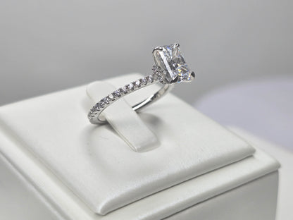 Side view of crushed ice zircon ring highlighting the elevated prong setting and accented band