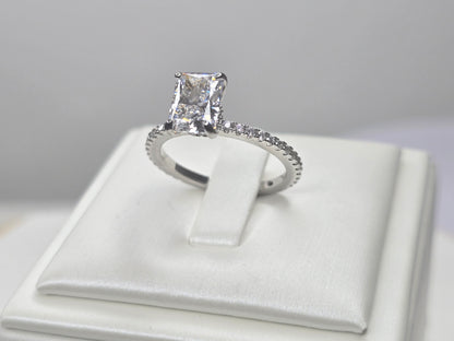 Angled view of sterling silver zircon engagement style ring showing facet light reflection